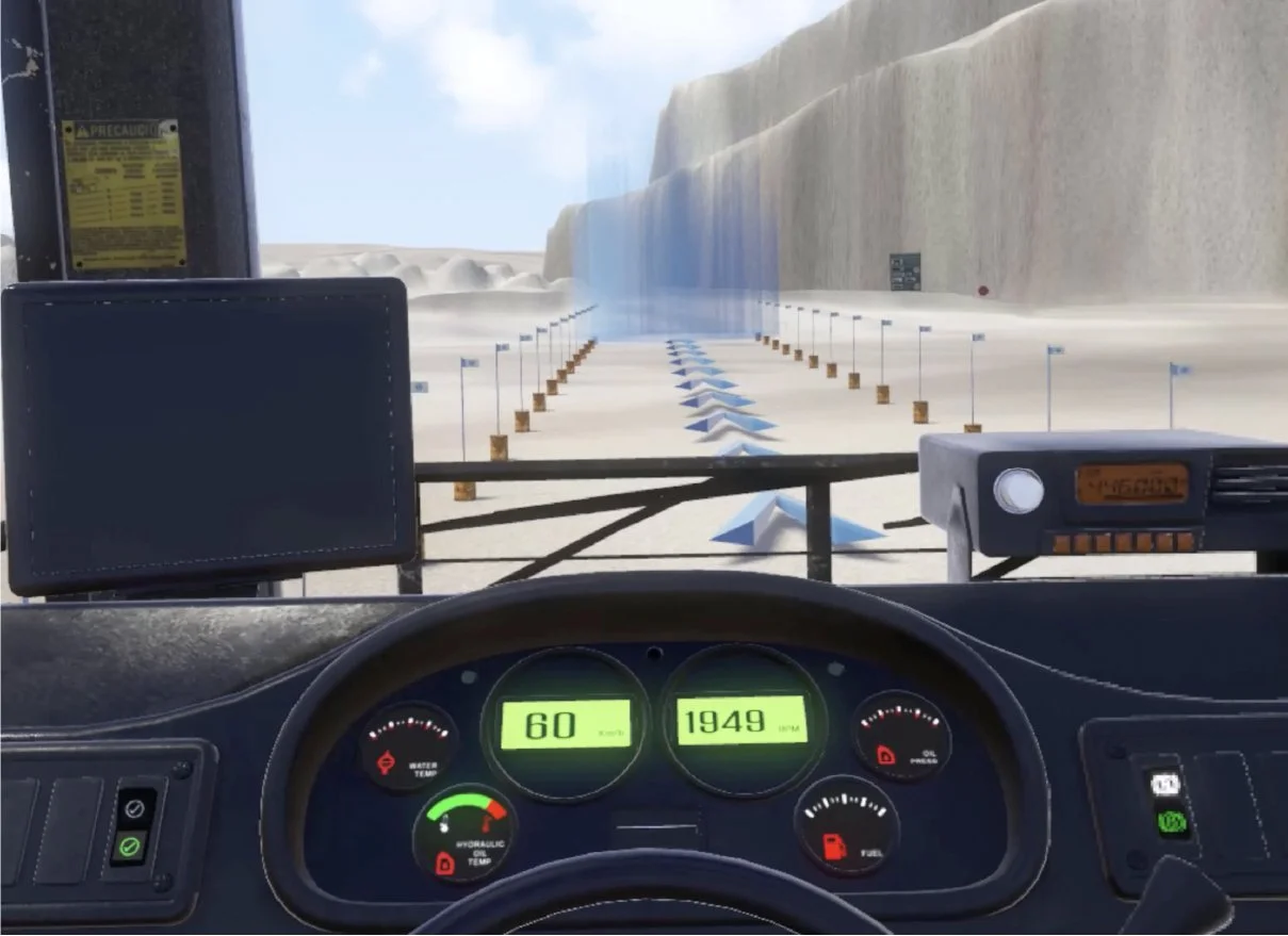 View from inside a vehicle simulator with a dashboard and virtual road