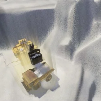 Dump truck on snowy terrain, back view, sunlight reflecting off snow
